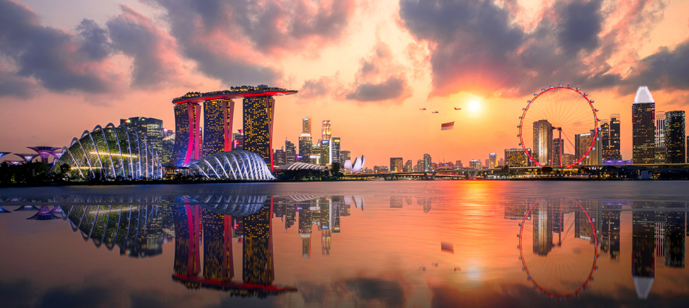 The Singapore city skyline reflected by the ocean