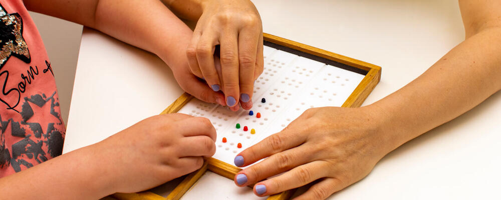 teacher and student playing educational game